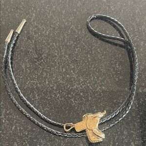 Gold tone saddle Pendant on Black Braided Bolo tie